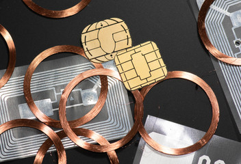 Close up of RFID Chips, Transponders an NFC Tags and Coils