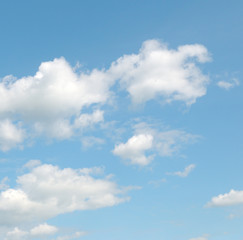 Obraz na płótnie Canvas white clouds on a blue sky background