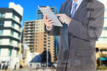 Double exposure of city and business man