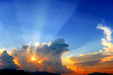 Sunset sky with sun rays