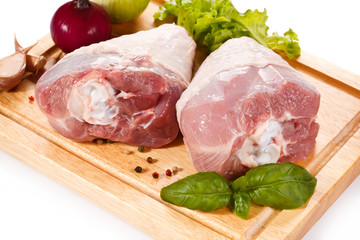 Raw turkey legs on cutting board 