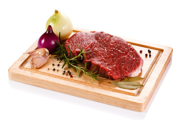 Fresh raw beef on cutting board on white background 