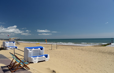 Deckchairs and loungers on beach at Bournemouth, Dorset