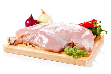 Raw turkey fillet on cutting board 