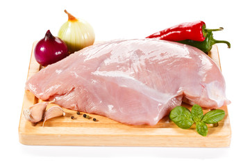 Raw turkey fillet on cutting board 