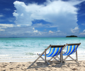 Beach chair on sand beach. Concept for rest, relaxation, holidays, spa, resort.