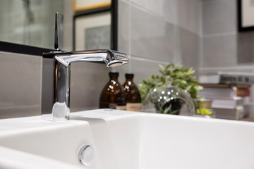 Modern faucet and wash basin in luxury bathroom
