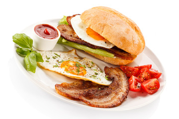 Breakfast - sandwich, egg, bacon and vegetables