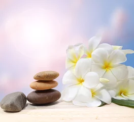 Foto op Canvas Zen spa concept background - Zen massage stones with frangipani plumeria flower © sittinan