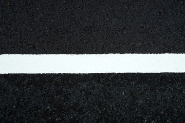 Fototapeta premium White Traffic lines on the road.