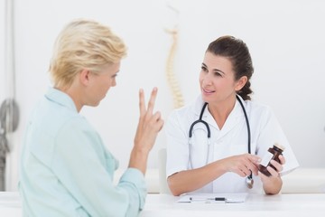 Doctor explaining treatment to her patient 