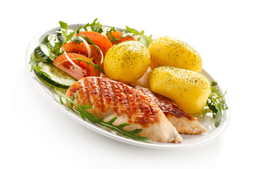 Grilled chicken fillets, boiled potatoes and vegetable salad 