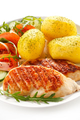 Grilled chicken fillets, boiled potatoes and vegetable salad 
