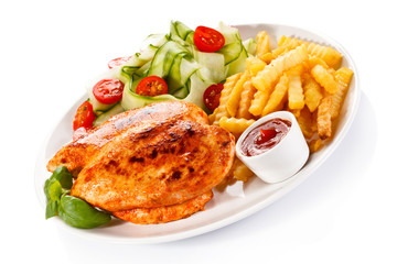 Fried chicken fillet, chips and vegetable salad 