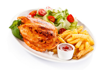 Fried chicken fillet, chips and vegetable salad 