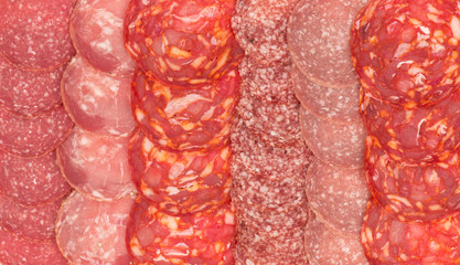 Background -variety of sliced salami.
