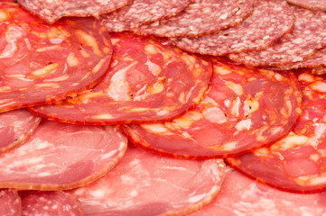 Background -variety of sliced salami.