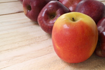 Sweet apples on wooden background