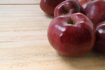 Sweet apples on wooden background