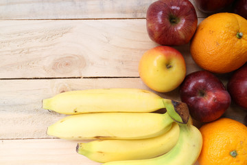 Fresh fruits  on the old wooden board