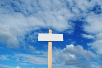 Poster on the background of blue cloudy sky