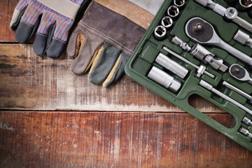 set of hand tools on a wooden panel