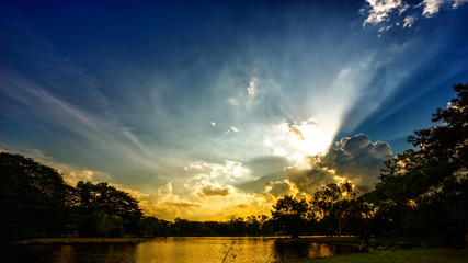 Sunset scene on lake with beautiful clouds and sky