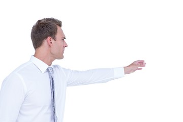 Side view of businessman showing something with his hand