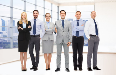 Fototapeta premium group of smiling businessmen making handshake