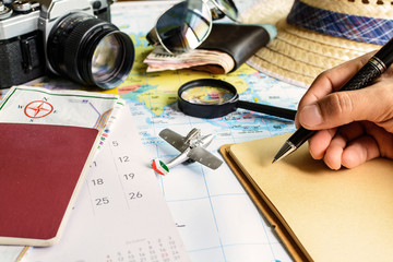 diary and calendar with passport and map