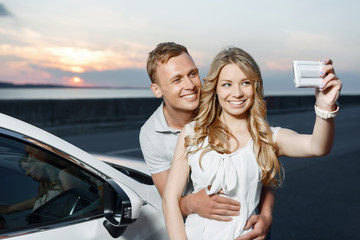 Lovely couple near the car