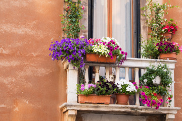 Fototapeta na wymiar Balcony with colorful flowers
