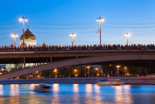Crowd of people waiting for the fireworks with Cathedral of Crist the Savior on the background, Moscow