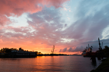 Fototapeta na wymiar reddish sunset over port