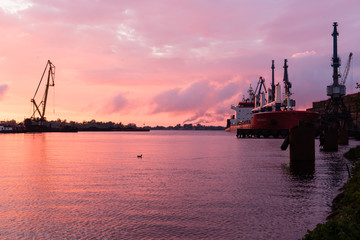 Fototapeta na wymiar reddish sunset over port