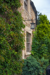 CHIPPENHAM, UK - AUGUST 9, 2014: Castle Combe, unique old English village. Old house