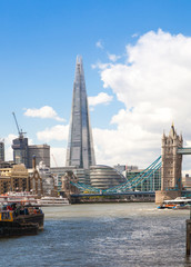 Fototapeta na wymiar LONDON, UK - APRIL 30, 2015: Shard and Tower bridge