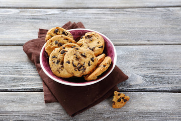 Biscuits in small bowl on rustic table
