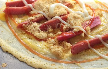 Making pancake on a hot stove