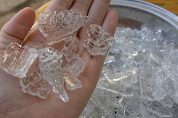 Spontaneous glass breakage - shards in the hand © mari_d