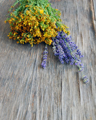background of lavender and St Johns wort on wooden table. Tutsan