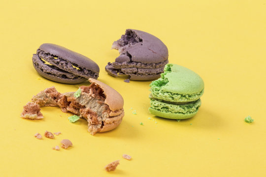 bitten macaroons on yellow