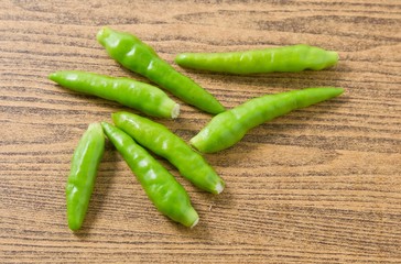 Fresh Green Chili Pepper on A Wooden Table