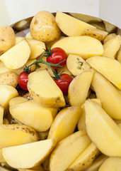 Potato slices with fresh tomatoes and spices