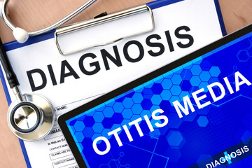 Fototapeta premium Form with word diagnosis and tablet with otitis media