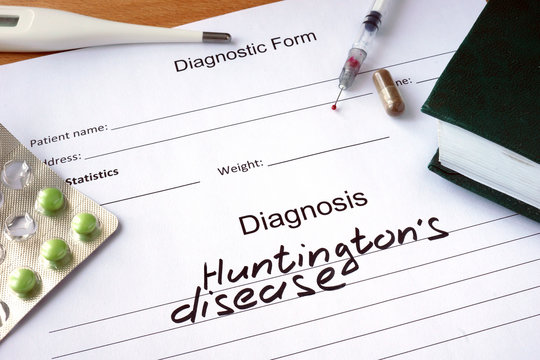 Diagnostic form with Diagnosis Huntington disease  and pills. 