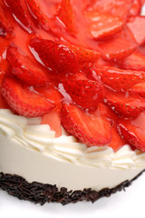 Cream cake with strawberries on white background