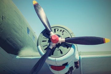 part plane with the propeller in retro tones