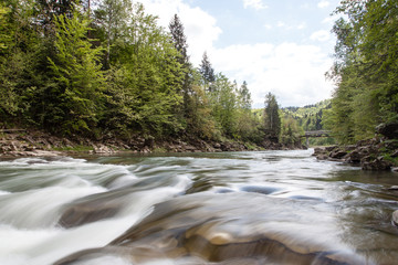 Peaceful flowing stream in mountains