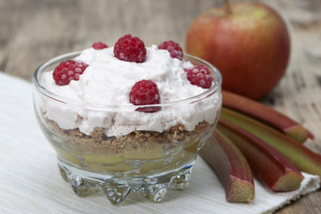 Desert from rhubarb, apples, crumbs  oatmeal cookies  , whipped